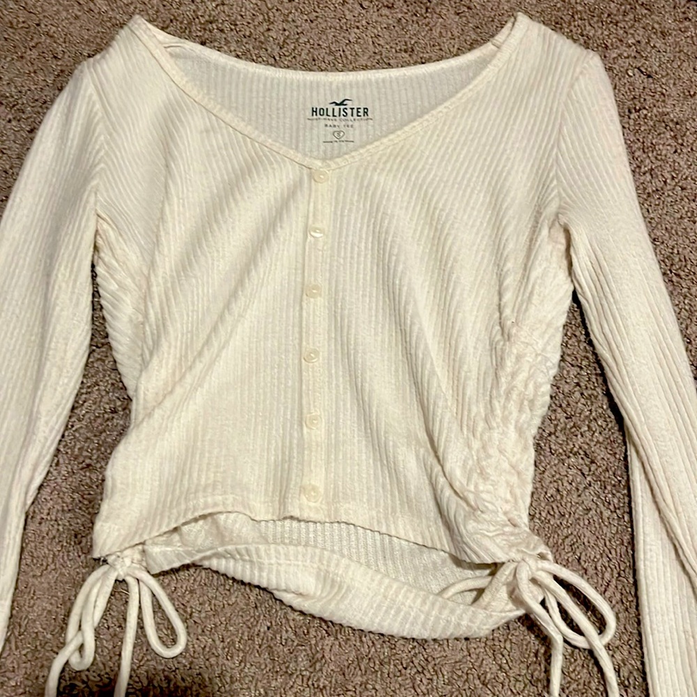 White/cream colored long sleeved sweater ￼